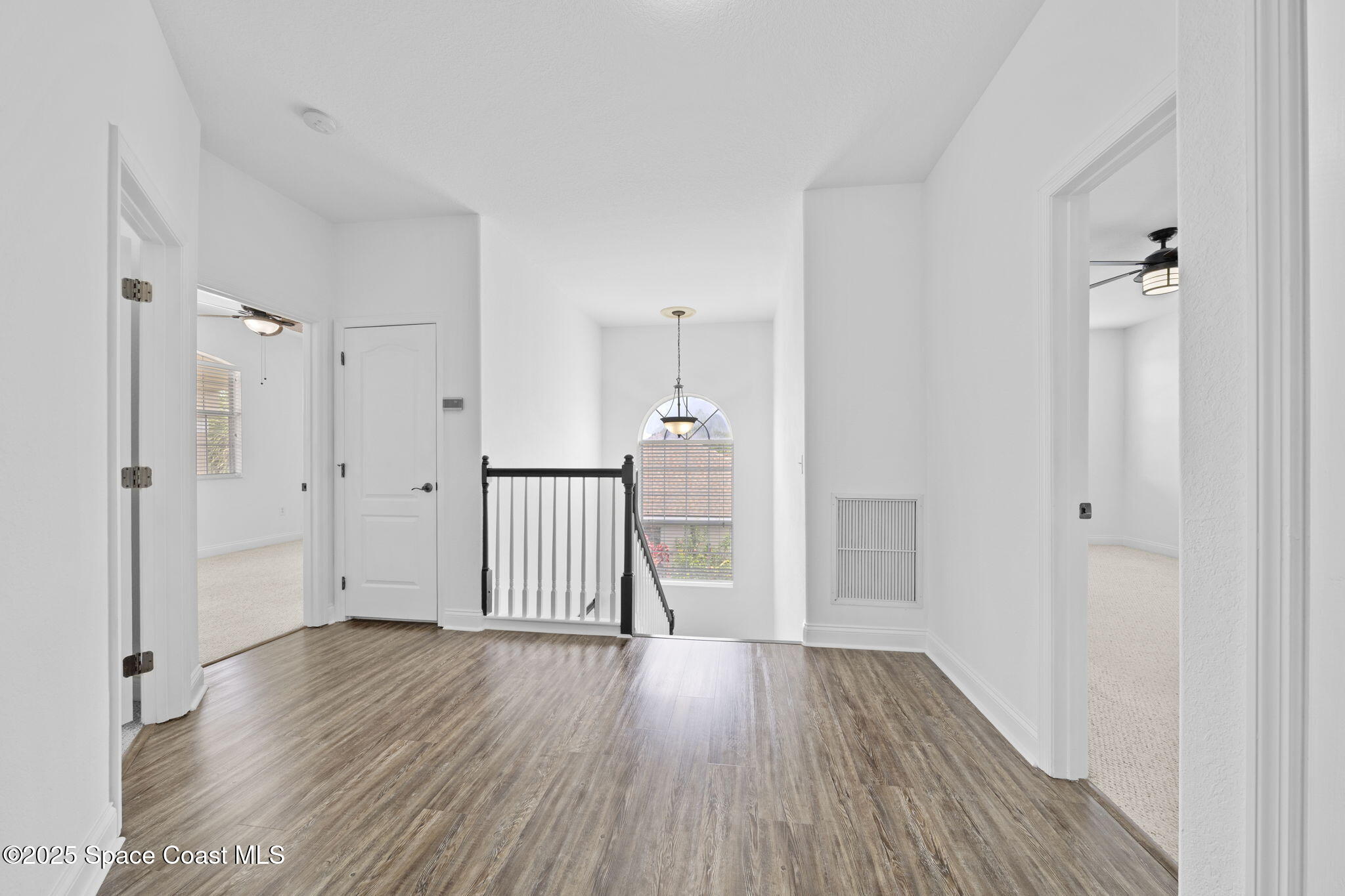 504 Glenbrook Circle Rockledge, FL 32955 - Photo 20 of 40 a view of empty room with wooden floor