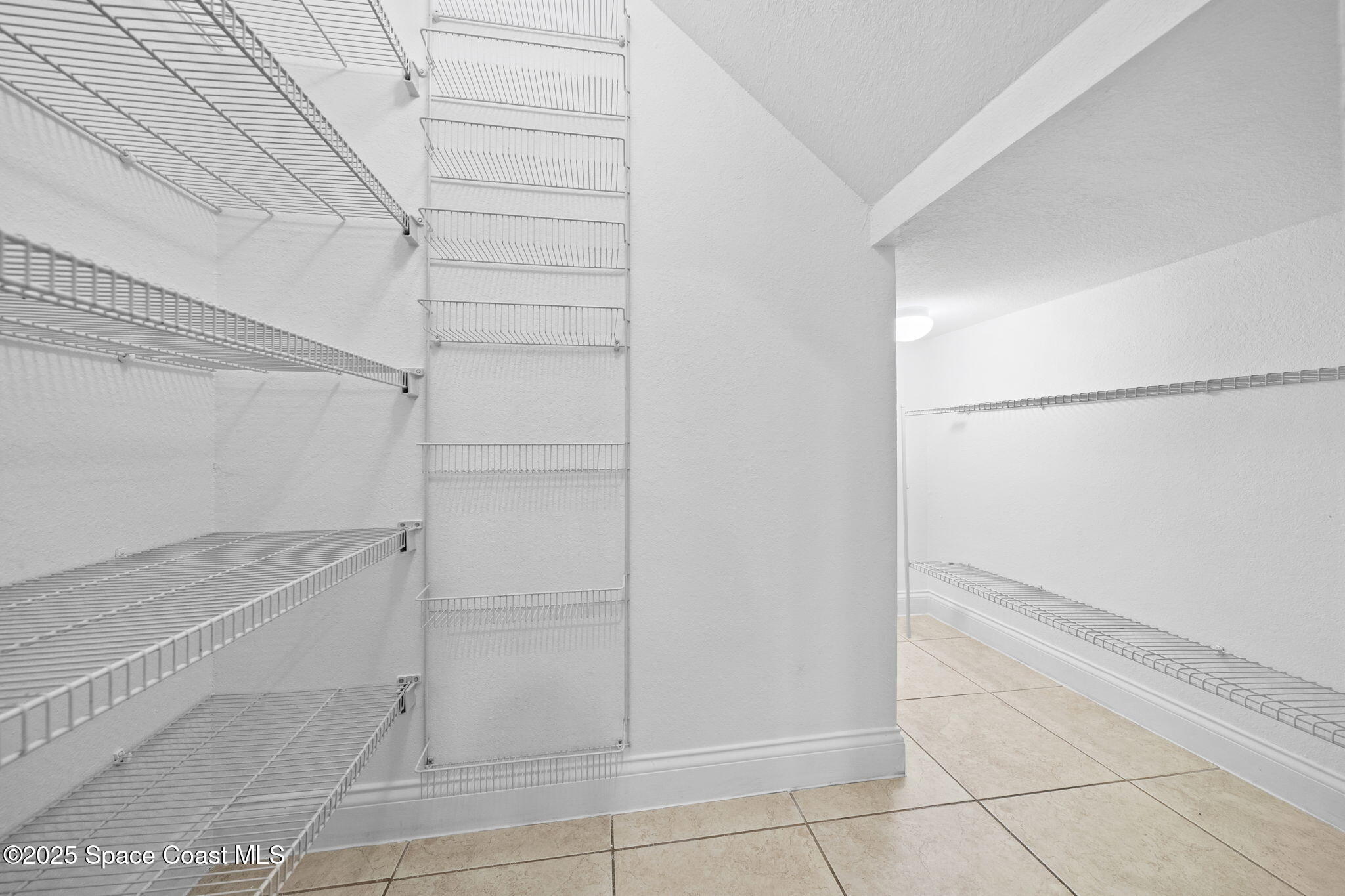 504 Glenbrook Circle Rockledge, FL 32955 - Photo 30 of 40 a view of walk in closet