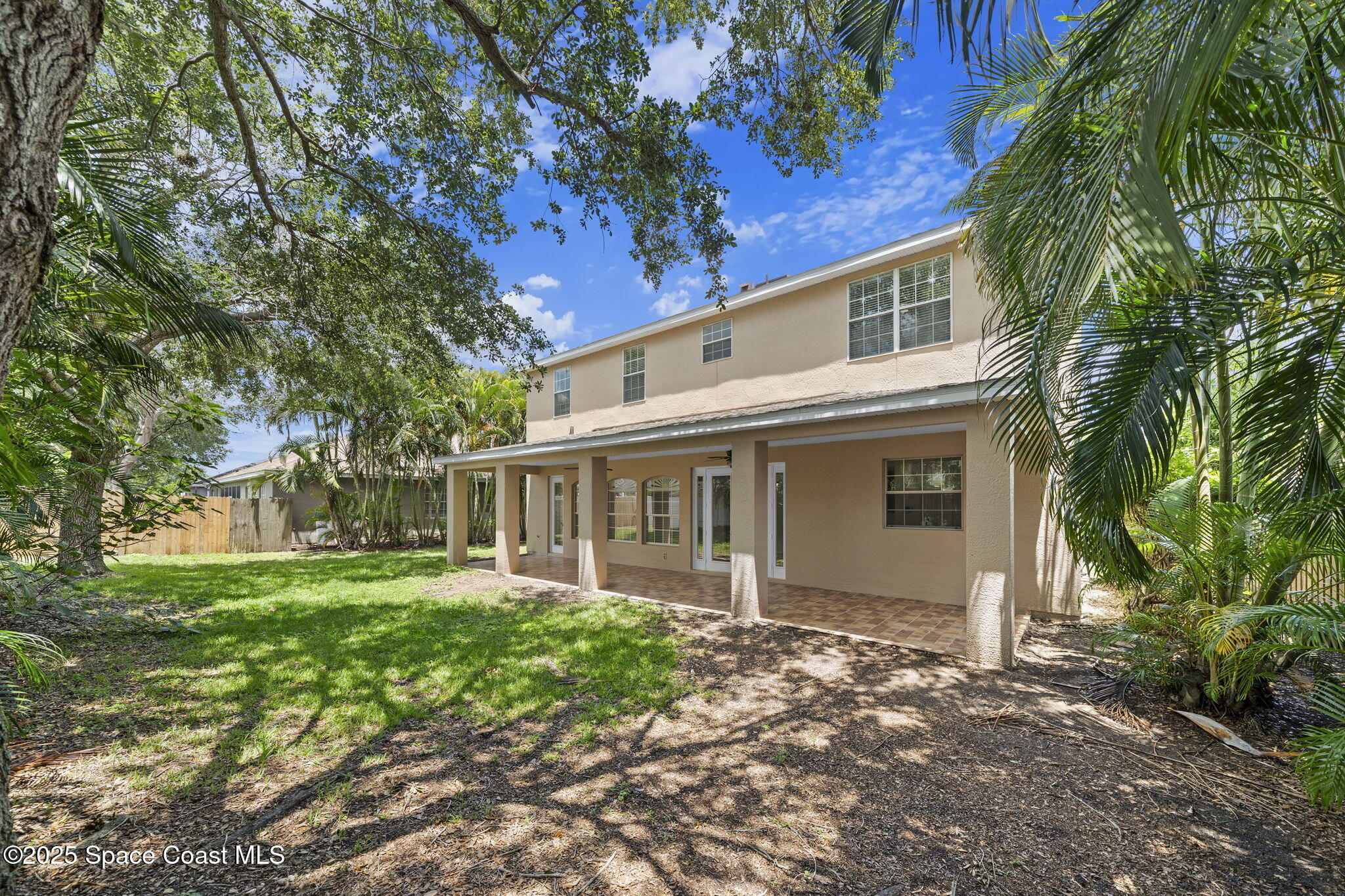 504 Glenbrook Circle Rockledge, FL 32955 - Photo 38 of 40 a front view of a house with a garden