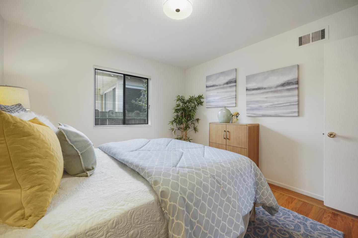 348 San Pablo Avenue Millbrae, CA 94030 - Photo 12 of 20 a bedroom with a bed and a window
