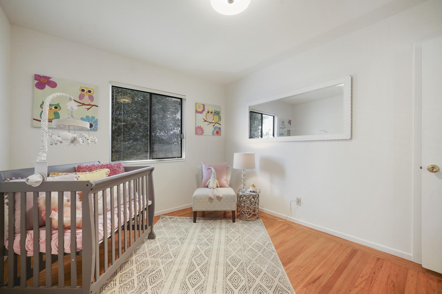 348 San Pablo Avenue Millbrae, CA 94030 - Photo 14 of 20 a bedroom with a bed and wooden floor