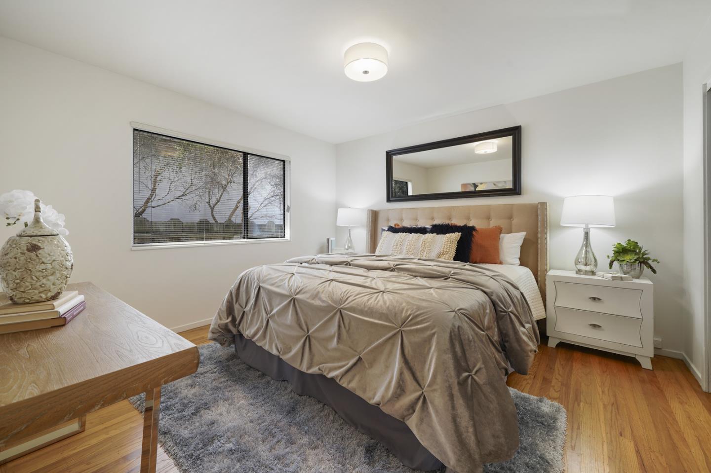 348 San Pablo Avenue Millbrae, CA 94030 - Photo 16 of 20 a bedroom with a bed and a dresser