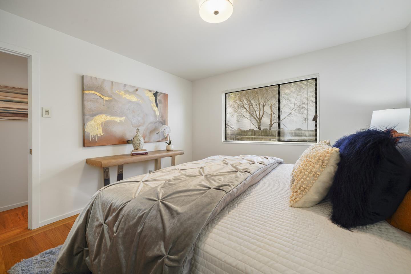 348 San Pablo Avenue Millbrae, CA 94030 - Photo 18 of 20 a bedroom with a bed and window