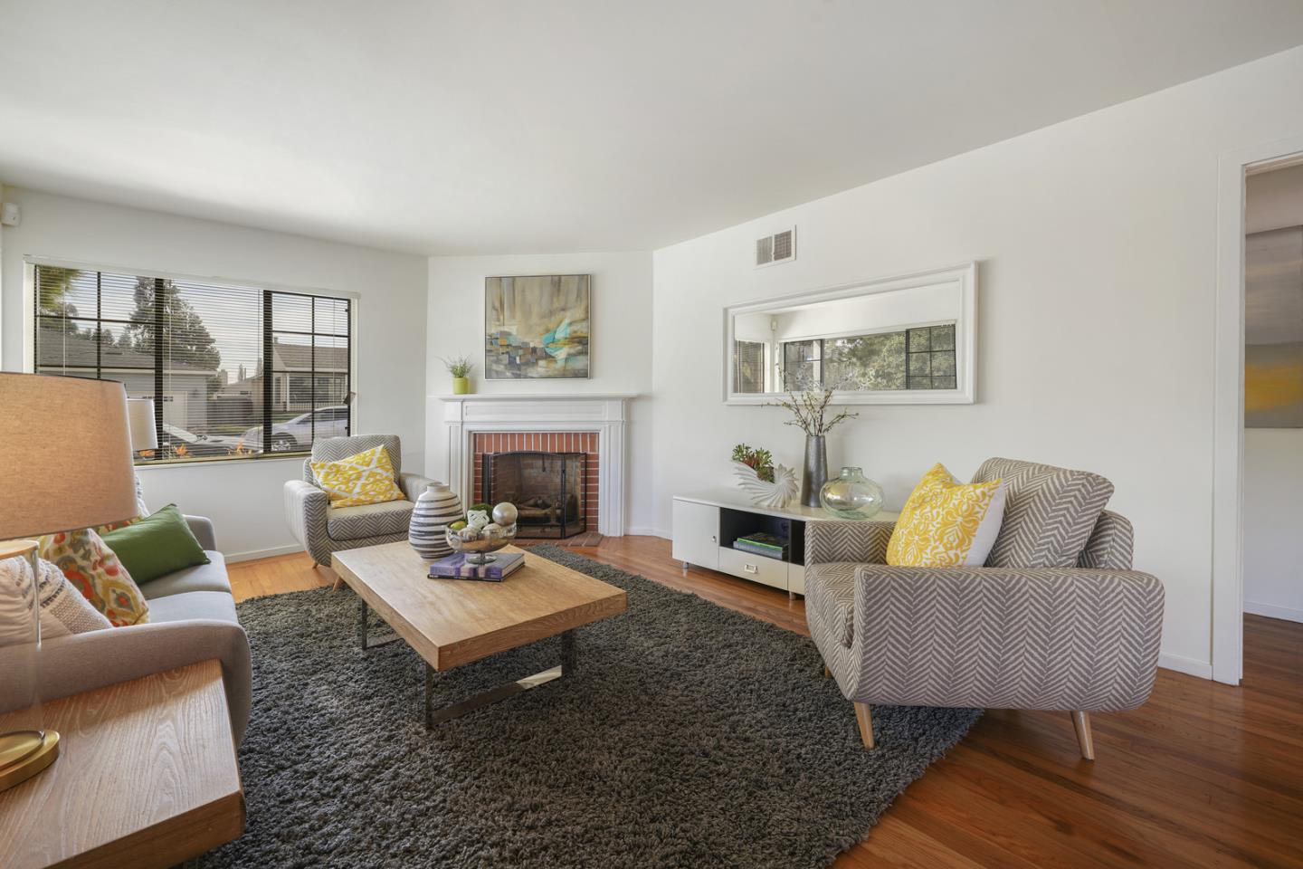 348 San Pablo Avenue Millbrae, CA 94030 - Photo 3 of 20 a living room with furniture and a fireplace