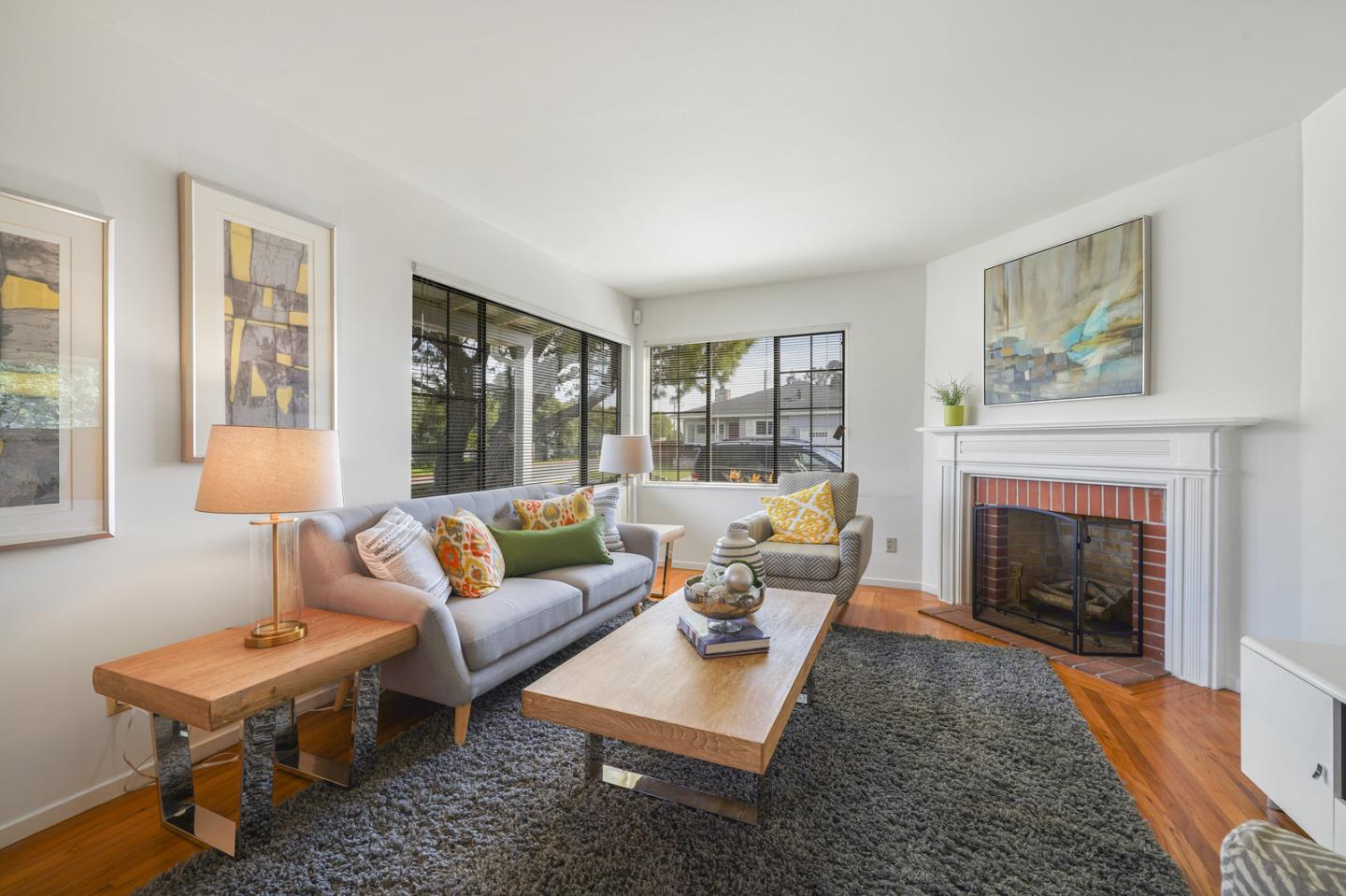 348 San Pablo Avenue Millbrae, CA 94030 - Photo 4 of 20 a living room with furniture and a fireplace