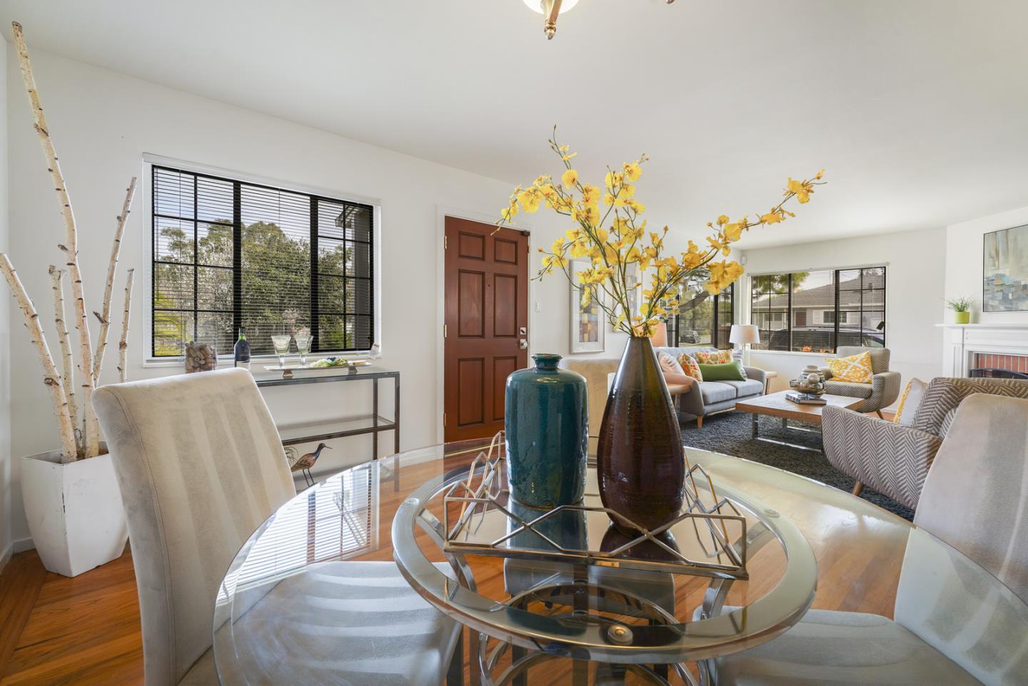 348 San Pablo Avenue Millbrae, CA 94030 - Photo 7 of 20 a living room with furniture a dining table and a large window