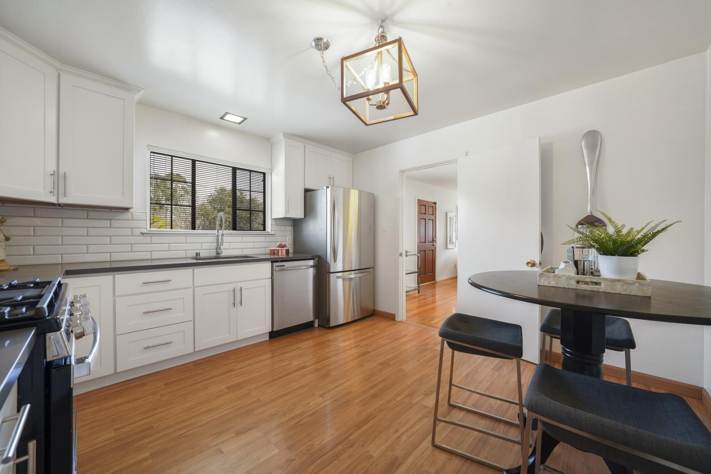 348 San Pablo Avenue Millbrae, CA 94030 - Photo 9 of 20 a kitchen with stainless steel appliances kitchen island granite countertop a refrigerator and microwave