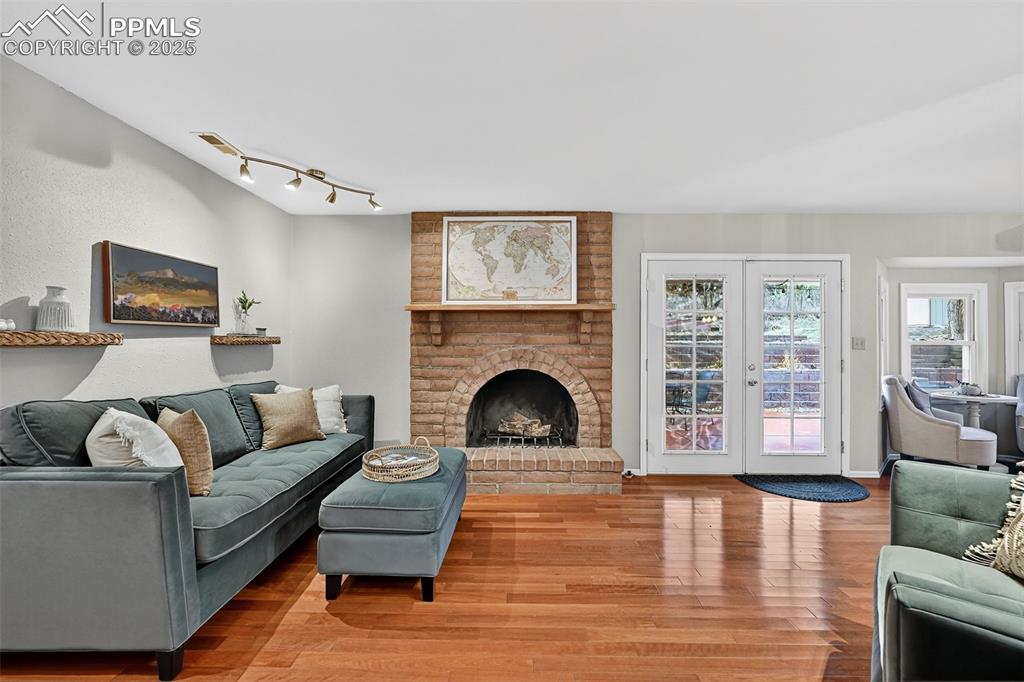 3102 Brenner Place Colorado Springs, CO 80917 - Photo 12 of 38 a living room with furniture and a fireplace