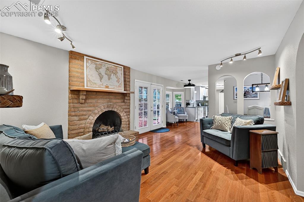 3102 Brenner Place Colorado Springs, CO 80917 - Photo 13 of 38 a living room with furniture and a fireplace
