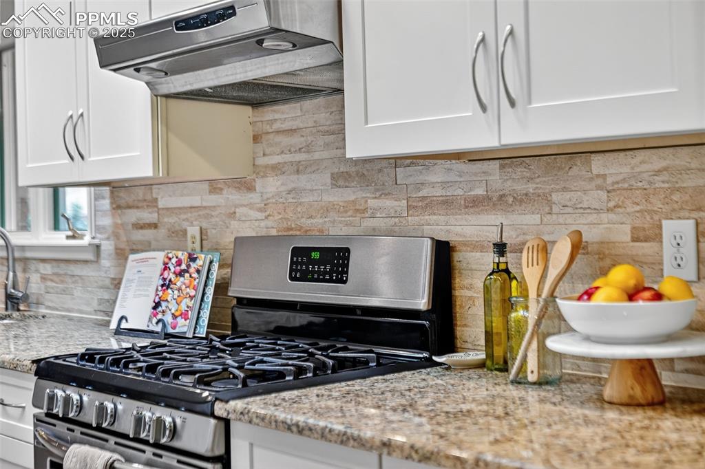 3102 Brenner Place Colorado Springs, CO 80917 - Photo 17 of 38 a stove top oven sitting inside of a kitchen