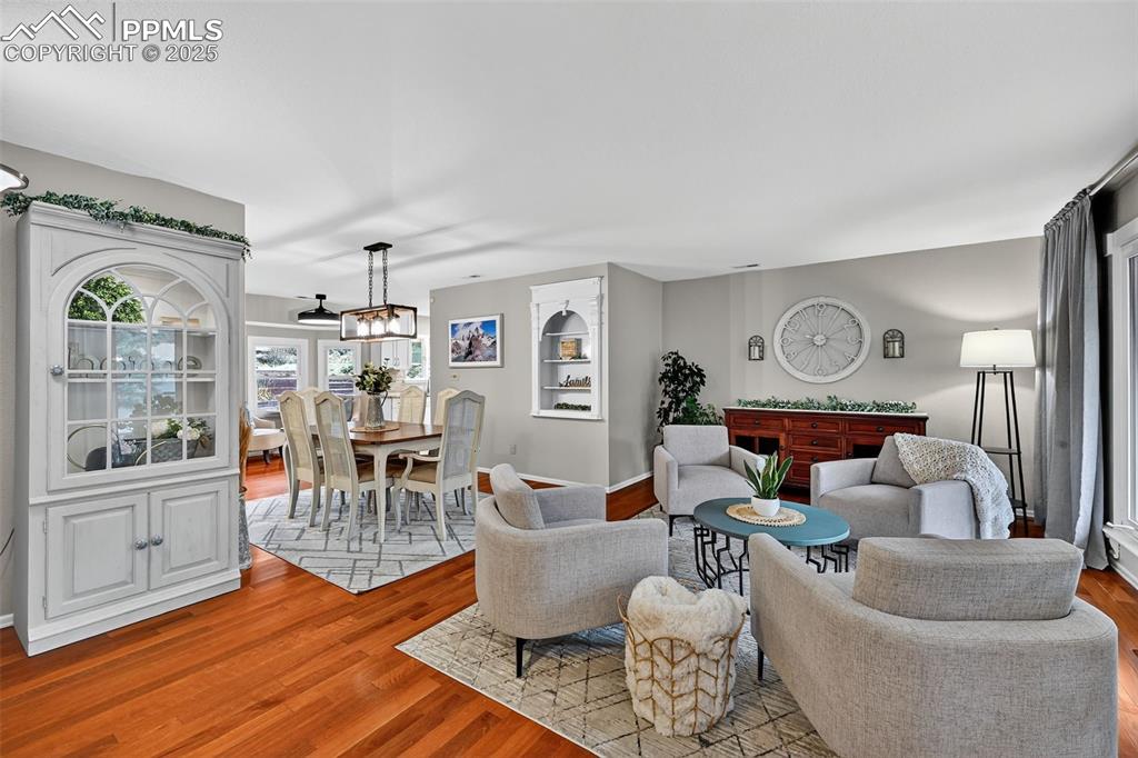 3102 Brenner Place Colorado Springs, CO 80917 - Photo 2 of 38 a living room with furniture and wooden floor