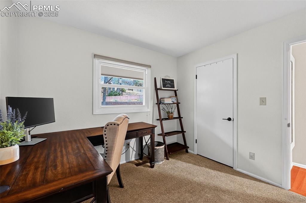 3102 Brenner Place Colorado Springs, CO 80917 - Photo 23 of 38 a view of a livingroom with furniture and a window
