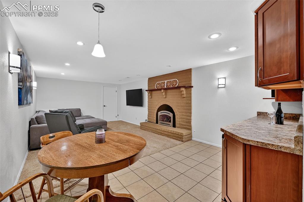 3102 Brenner Place Colorado Springs, CO 80917 - Photo 27 of 38 a kitchen with a sink cabinets and window
