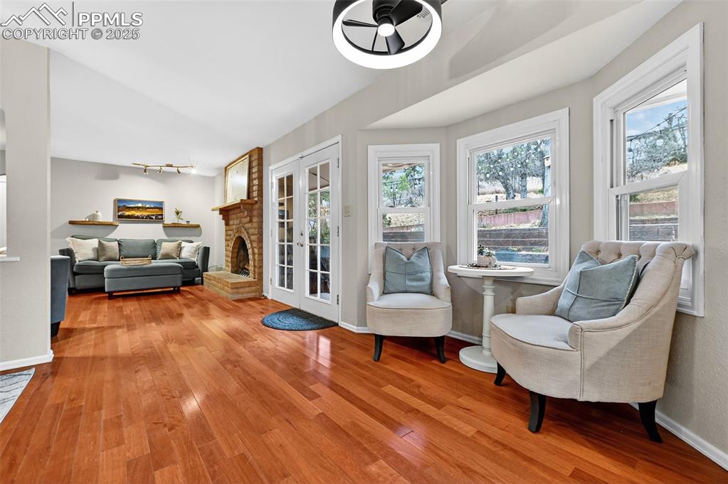 3102 Brenner Place Colorado Springs, CO 80917 - Photo 9 of 38 a living room with furniture and a hard wood floor