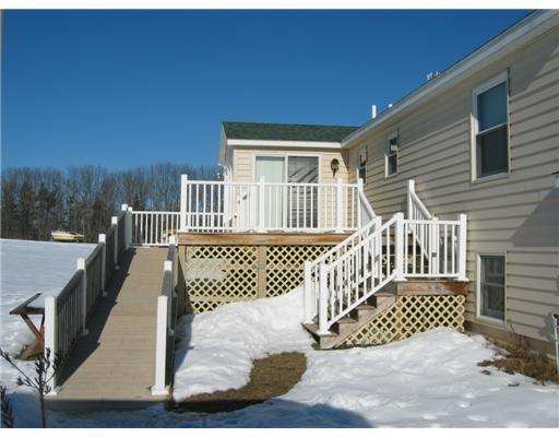 137 Pleasant Hill Road Sabattus, ME 04280 - Photo 11 of 12 Patio/Deck. Handicap accessible ramp.