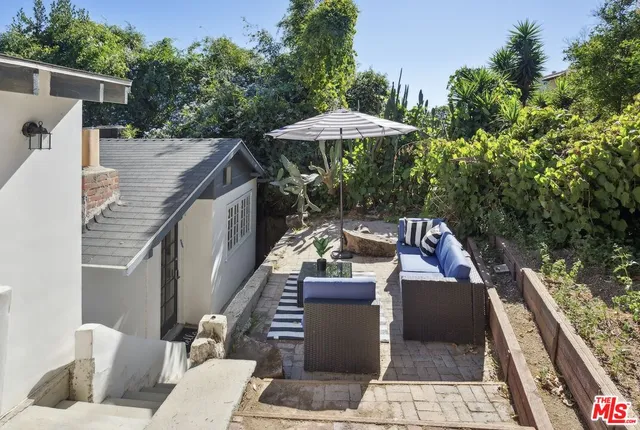 a terrace of a house with outdoor seating
