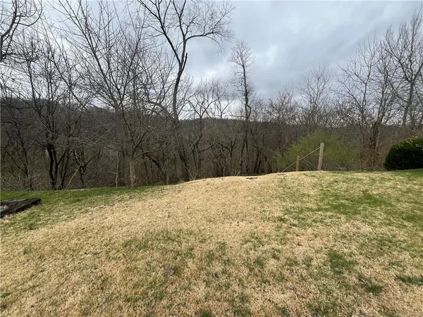 a view of a backyard of the house