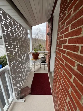 a kitchen with cabinets appliances a sink and a counter top space
