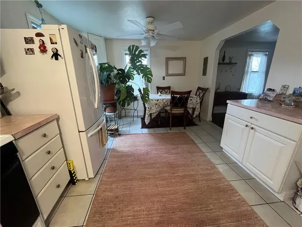 a kitchen with stainless steel appliances a stove a refrigerator and cabinets