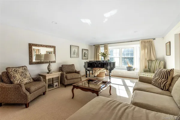 a living room with furniture or couch and a wooden floor
