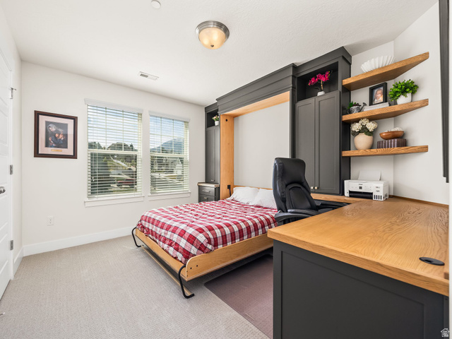 117 Ridge View Drive Elk Ridge, UT 84651 - Photo 25 of 42 Bedroom featuring light colored carpet and a desk