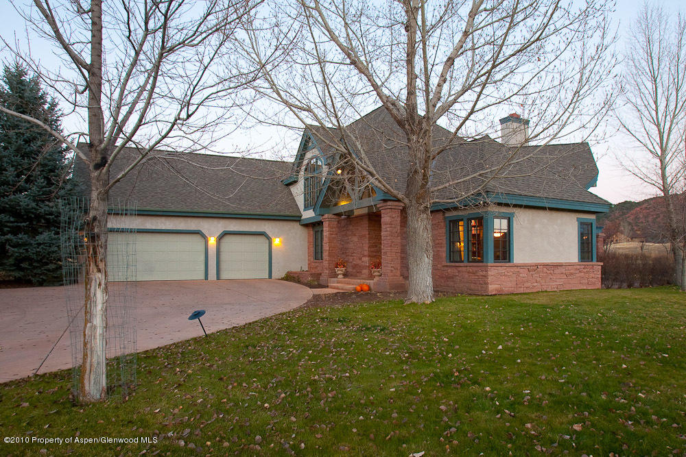 254 Diamond A Ranch Road Carbondale, CO 81623 - Photo 3 of 12 a front view of a house with a yard and garage