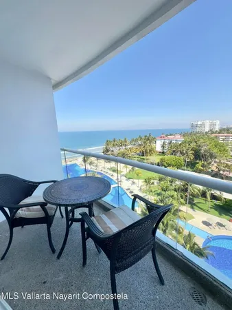 a view of swimming pool with furniture
