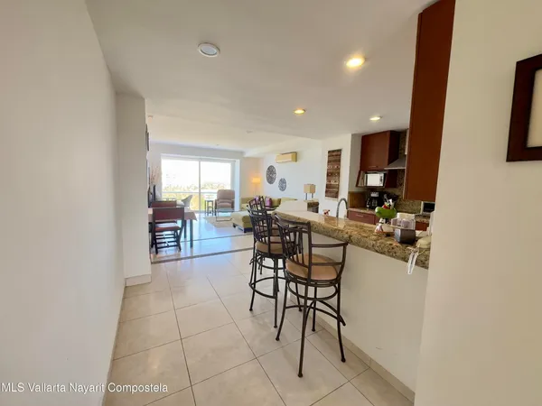 a view of a livingroom with furniture and window
