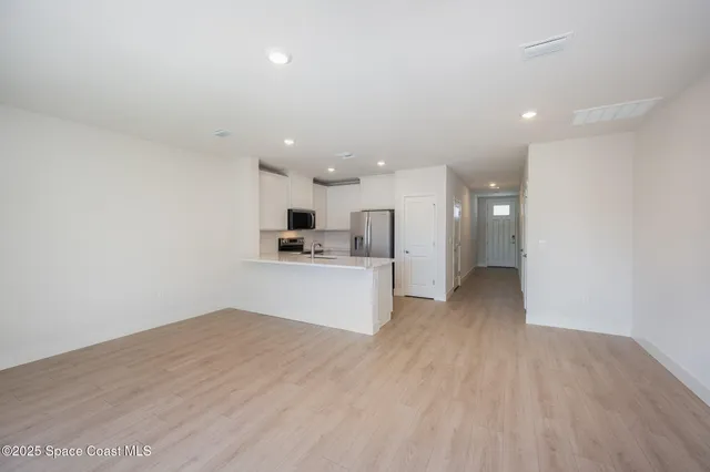 a view of kitchen with wooden floor
