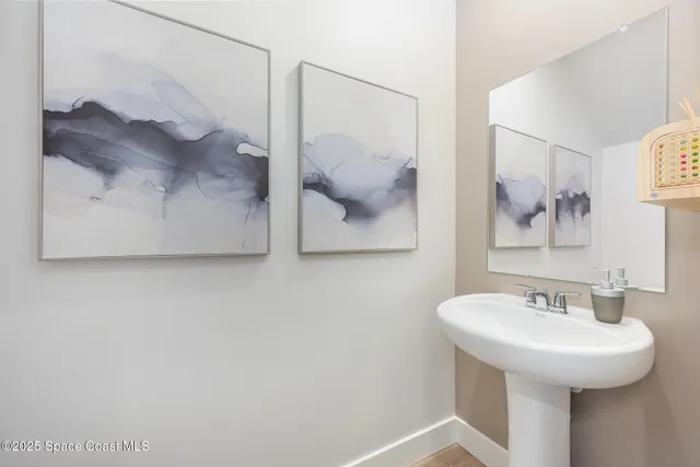 a bathroom with a sink and mirror