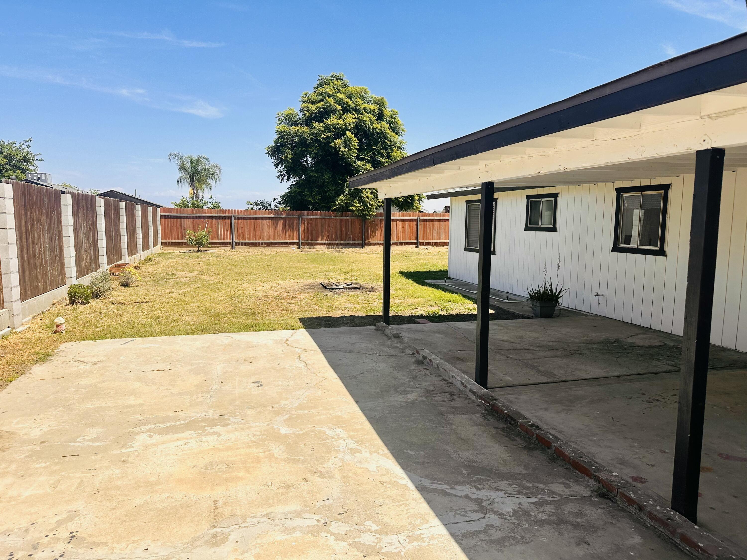 30880 Farr Road Visalia, CA 93291 - Photo 22 of 27 a view of swimming pool with a house