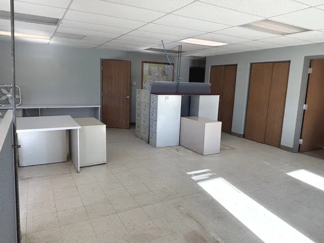 a room with furniture a bed and a window