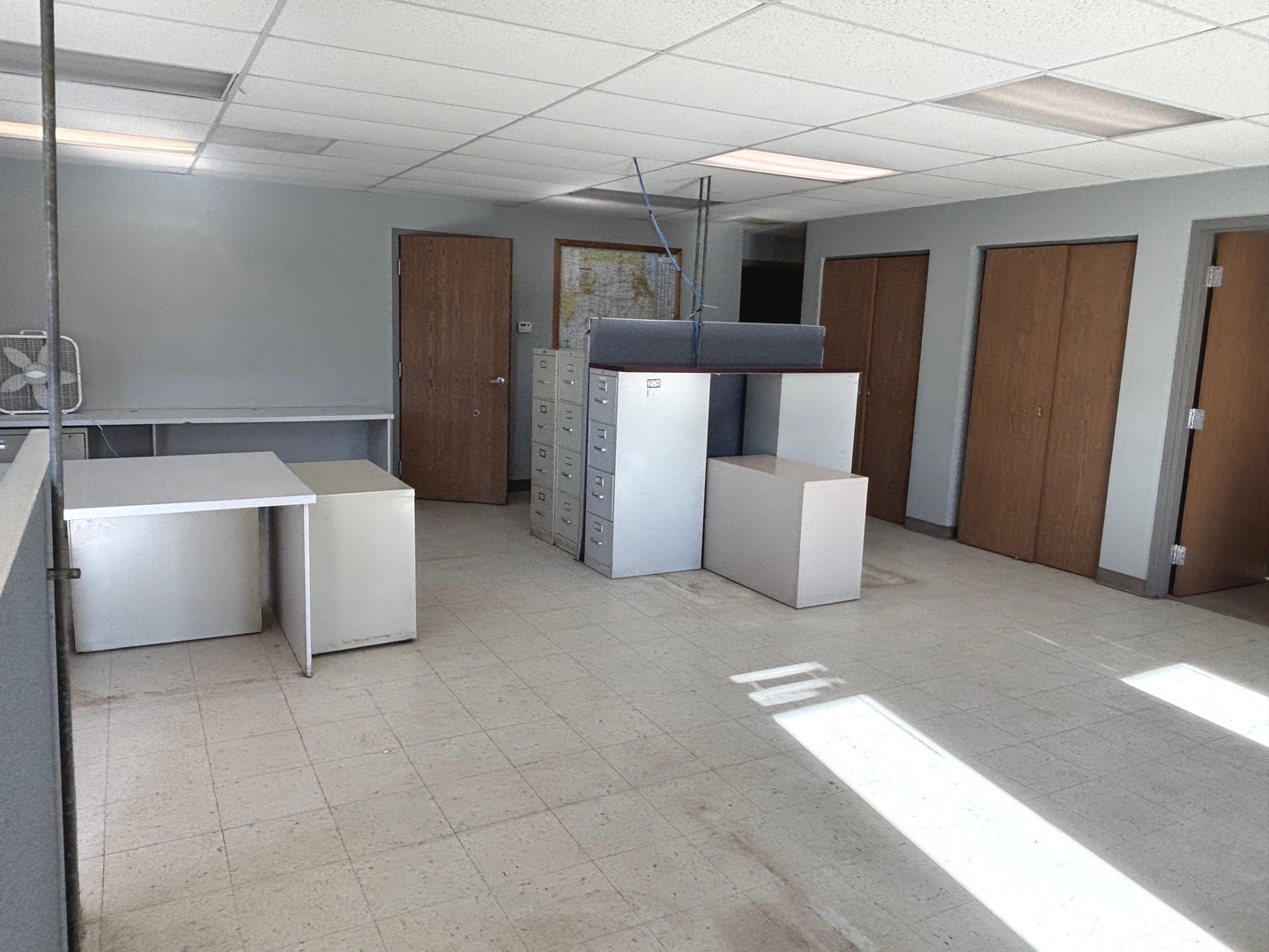 2106 County Road 1000 East Champaign, IL 61822 - Photo 13 of 26 a living room with a couch and a washer dryer