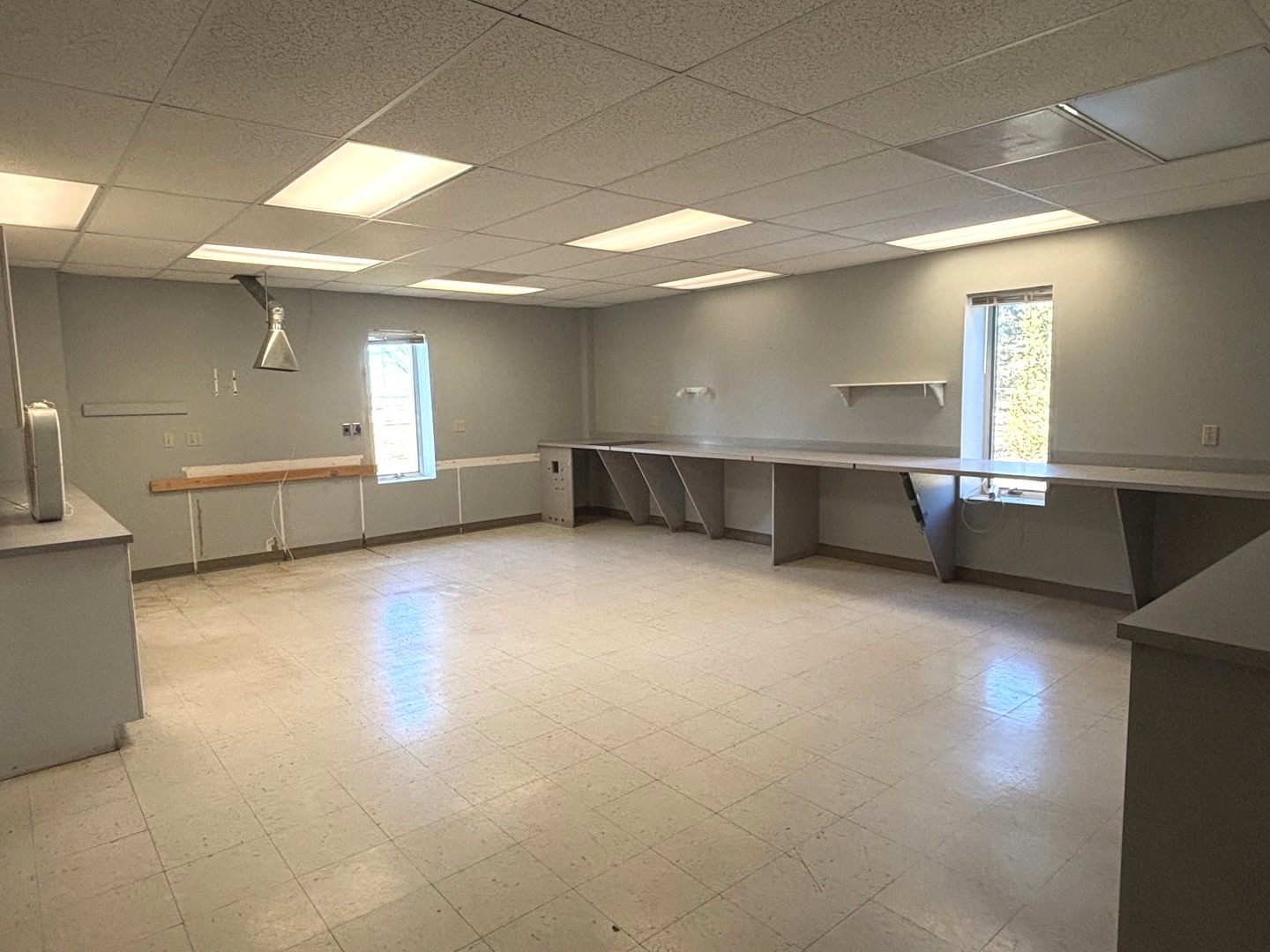 2106 County Road 1000 East Champaign, IL 61822 - Photo 18 of 26 an empty room with a fireplace and windows