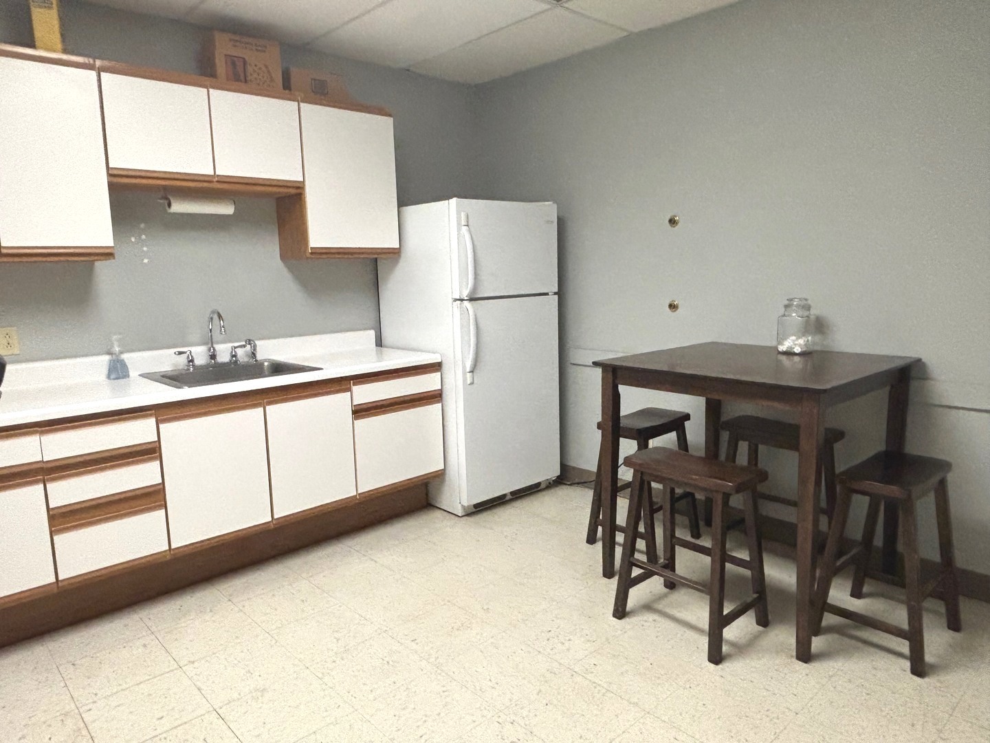 2106 County Road 1000 East Champaign, IL 61822 - Photo 24 of 26 a kitchen with a sink a table and chairs