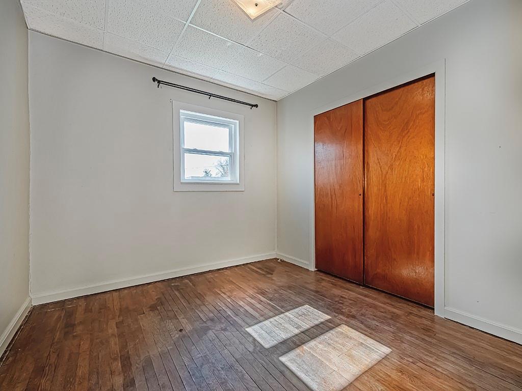 1694 Dime Road Vandergrift, PA 15690 - Photo 13 of 35 an empty room with wooden floor and windows
