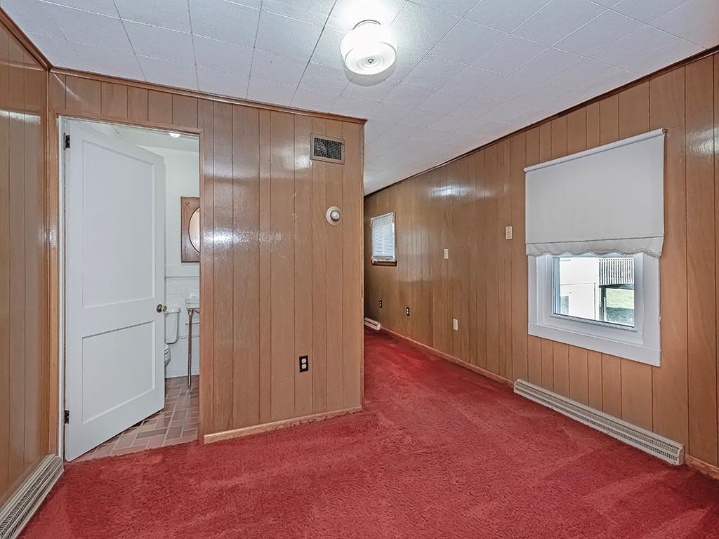 1694 Dime Road Vandergrift, PA 15690 - Photo 15 of 35 a view of an empty room with window and wooden floor