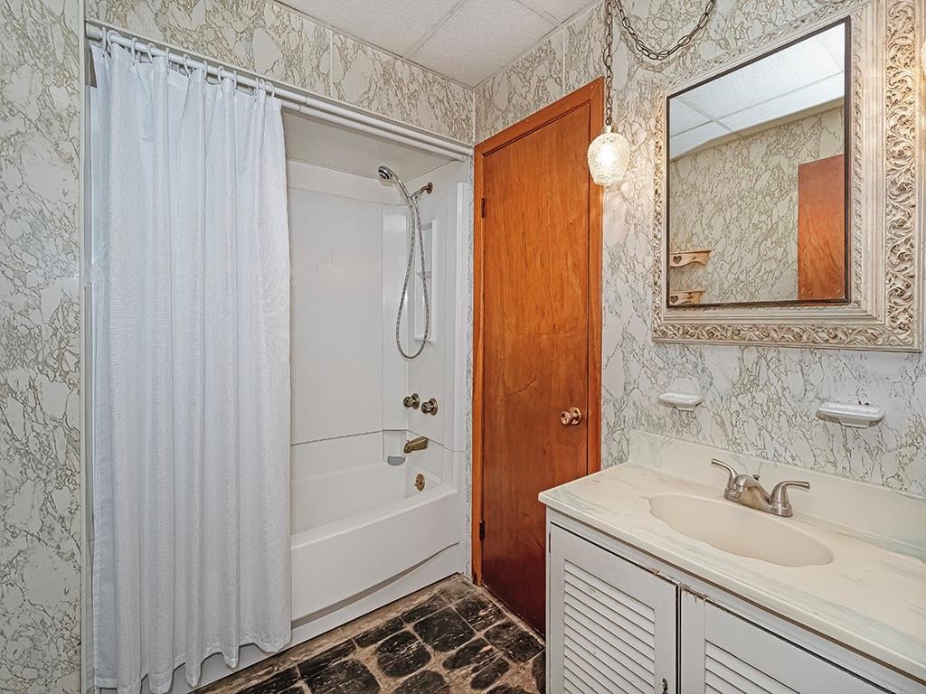 1694 Dime Road Vandergrift, PA 15690 - Photo 16 of 35 a bathroom with a sink and a mirror