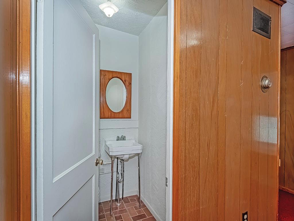 1694 Dime Road Vandergrift, PA 15690 - Photo 17 of 35 a bathroom with a sink and a mirror