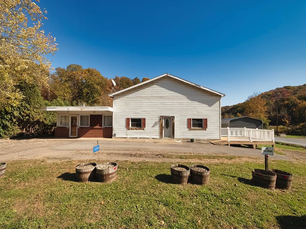 1694 Dime Road Vandergrift, PA 15690 - Photo 22 of 35 a front view of a house with a yard