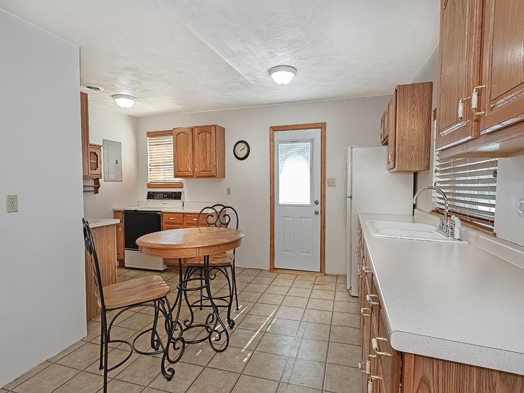 1694 Dime Road Vandergrift, PA 15690 - Photo 26 of 35 a view of a kitchen with furniture and a refrigerator