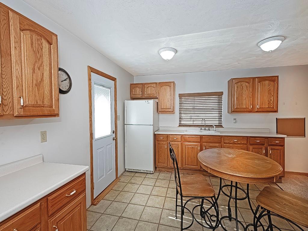 1694 Dime Road Vandergrift, PA 15690 - Photo 28 of 35 a kitchen with stainless steel appliances granite countertop a sink and a refrigerator