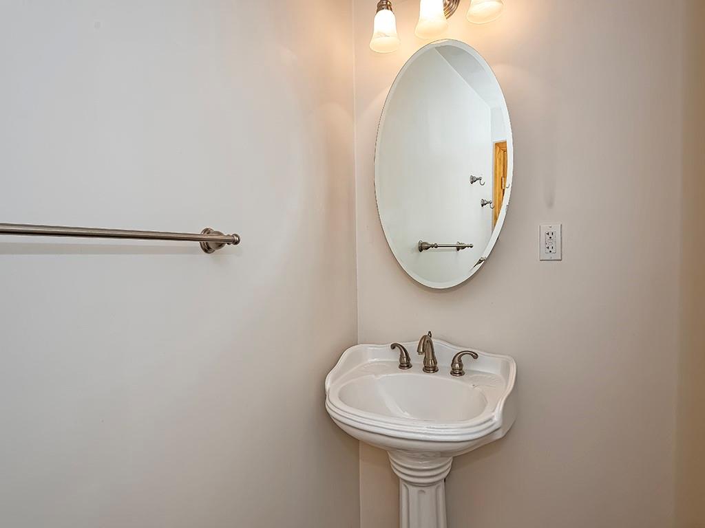 1694 Dime Road Vandergrift, PA 15690 - Photo 35 of 35 a bathroom with a sink and a mirror