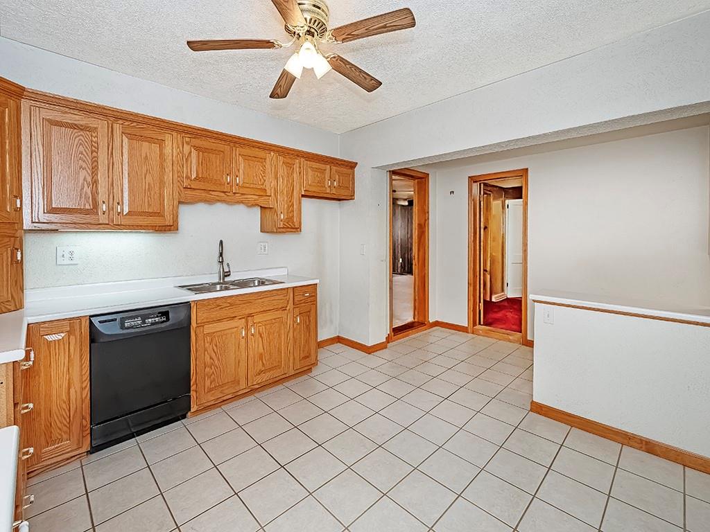 1694 Dime Road Vandergrift, PA 15690 - Photo 7 of 35 a kitchen with stainless steel appliances granite countertop a refrigerator and a stove top oven