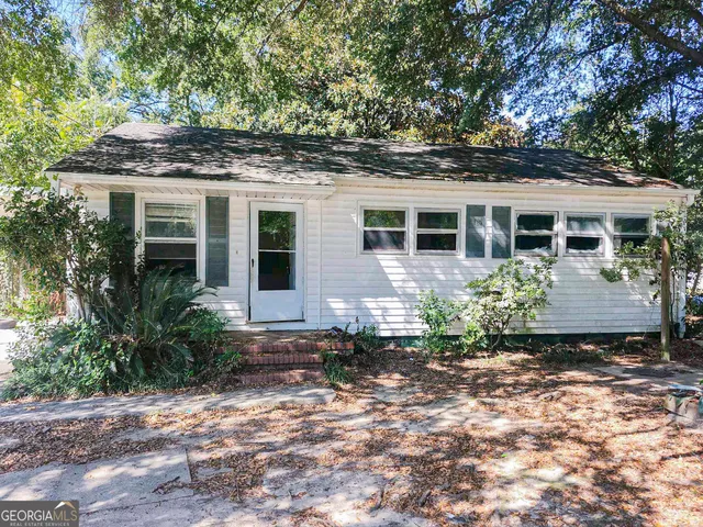 a view of a house with a garden