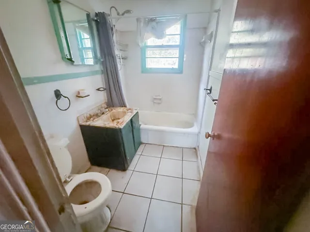 a bathroom with a toilet and a sink