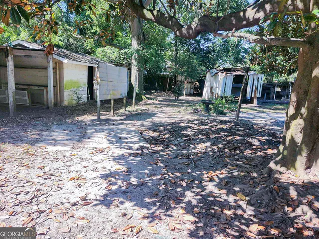 a backyard of a house with lots of green space
