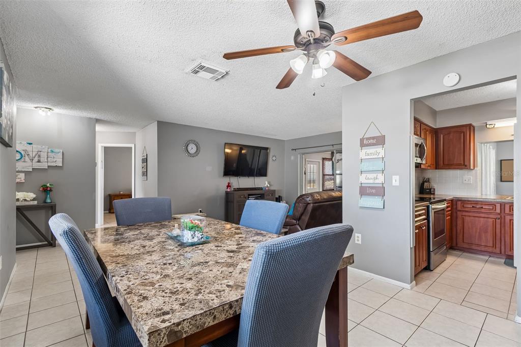 5478 Waycross Drive Spring Hill, FL 34606 - Photo 11 of 29 a view of a dining room with furniture