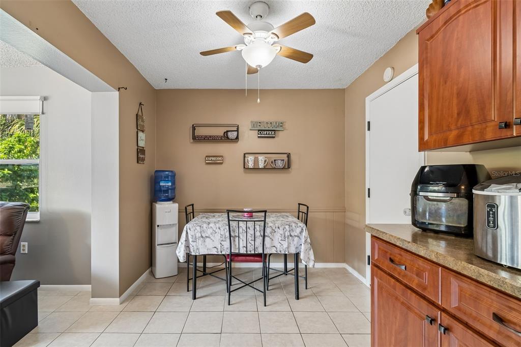 5478 Waycross Drive Spring Hill, FL 34606 - Photo 16 of 29 a kitchen with stainless steel appliances granite countertop a refrigerator and a stove top oven