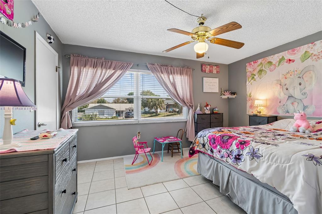 5478 Waycross Drive Spring Hill, FL 34606 - Photo 21 of 29 a bedroom with a bed and a window